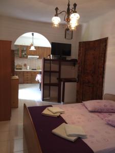 Postel nebo postele na pokoji v ubytování Apartmani Luiza