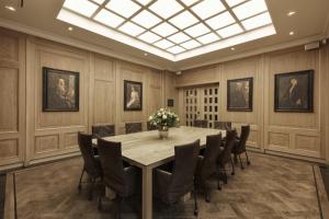 a conference room with a table and chairs at Hotel Dux in Roermond