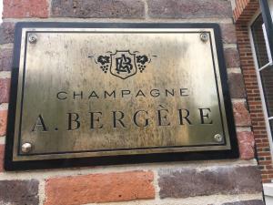 
a sign on the side of a brick building at Champagne André Bergère in Épernay
