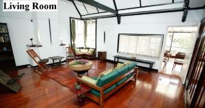 a living room with a couch and a table at Kiloran House in Nairobi