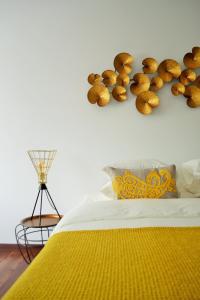 a bed with a bunch of teddy bears on the wall at Feeling Eduardo VII in Lisbon