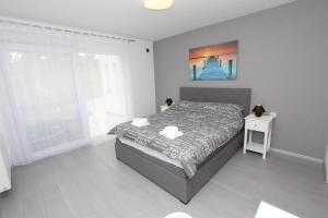 a bedroom with a bed and a large window at Apartment Karlo 2 in Rovinj +35 photos