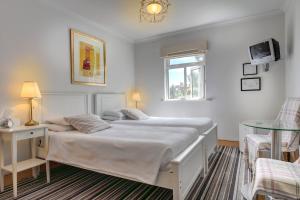 Voodi või voodid majutusasutuse St. Aiden's Guesthouse toas
