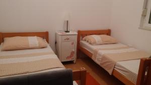 Postel nebo postele na pokoji v ubytování Apartment Dario