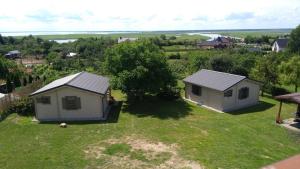 an aerial view of a small house on a yard at Domki Przy Orzechu in Lubin