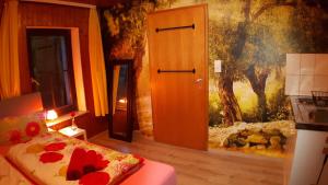 a bedroom with a bed and a painting on the wall at Das Haus am Hang in Schwäbisch Hall +76 photos