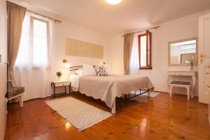 Postel nebo postele na pokoji v ubytování Guesthouse Casa Vittoria