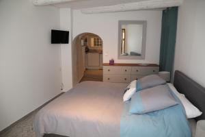 Ένα ή περισσότερα κρεβάτια σε δωμάτιο στο La Bignone