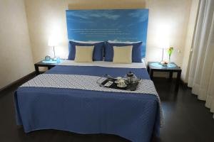Mare Nostrum Petit Hôtel客房内的一张或多张床位