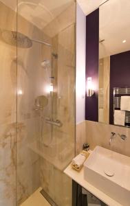 a bathroom with a shower and a sink at Hotel Beethoven Wien in Vienna