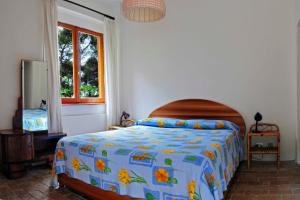 A bed or beds in a room at B&B Al Cavalluccio Marino