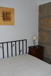 Uma cama ou camas num quarto em Casa do Cho do Ribeiro