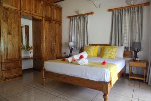 Postel nebo postele na pokoji v ubytování Grann Kaz Guest House