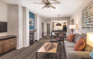 a living room with a couch and a fireplace at WorldMark Scottsdale in Scottsdale