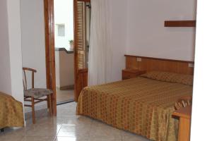Voodi või voodid majutusasutuse Hotel La Filadelfia toas