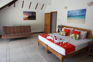 Postel nebo postele na pokoji v ubytování Grann Kaz Guest House