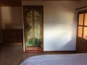 a bedroom with a door leading into a room at Appartement Claude in Courchevel