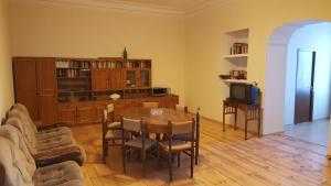a living room with a table and a couch at Apartment Chavchavadze 5 in Sighnaghi