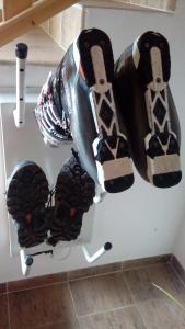 a pair of shoes hanging on a wall at Apartmány MarAqua in Liptovský Trnovec