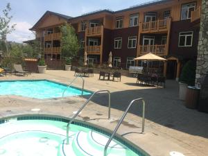 a swimming pool in front of a apartment complex at Sunstone Lodge by 101 Great Escapes in Mammoth Lakes