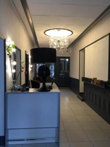 an office lobby with a blue light on a desk at Hotel Ar Terra Nova in Saint Malo