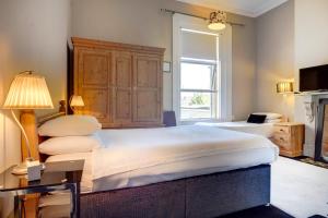 Voodi või voodid majutusasutuse St. Aiden's Guesthouse toas