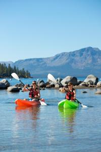 two people in kayaks on a body of water at Hotel Becket in South Lake Tahoe
