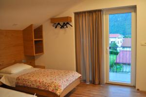 Postel nebo postele na pokoji v ubytování Apartments ALPA VITA