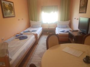 Postel nebo postele na pokoji v ubytování Guest House Rose