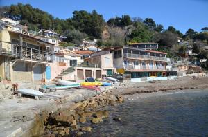 a group of buildings on the shore of a beach at Station balnéaire Pradet entre Toulon et Hyères proche plages in Le Pradet