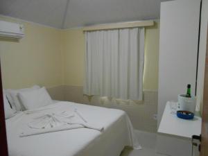 Een bed of bedden in een kamer bij Hotel SESI Valença