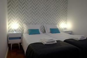 Een bed of bedden in een kamer bij Casa da Travessa