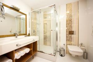 A bathroom at Aprilis Hotel - Special Category Még 37 kép