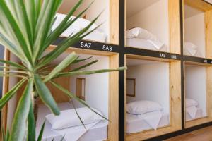 Ένα ή περισσότερα κρεβάτια σε δωμάτιο στο Woopi Backpackers +51 φωτογραφίες