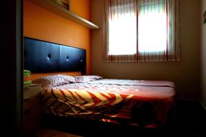 Een bed of bedden in een kamer bij Can Vinyals Holiday Home