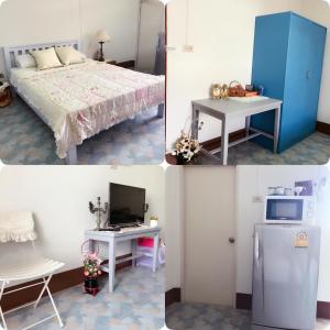 a room with a bed and a desk and a refrigerator at Chanathinat Place in Udon Thani