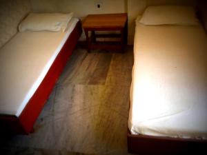 Postel nebo postele na pokoji v ubytování GP Mansion + 2 fotografie