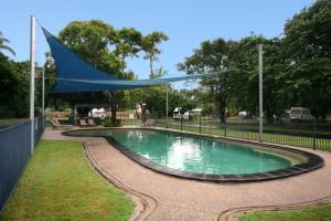 a pool with a pool table and a fountain at NRMA Cairns Holiday Park in Cairns