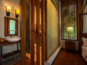 Rúm í herbergi á Dali Yunxi Boutique Inn