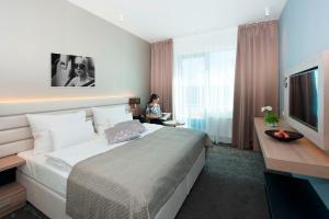 Letto o letti in una camera di Grid Hotel