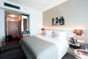 Letto o letti in una camera di Grid Hotel