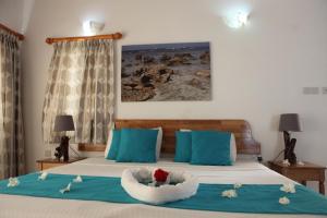 Postel nebo postele na pokoji v ubytování Grann Kaz Guest House