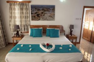 Postel nebo postele na pokoji v ubytování Grann Kaz Guest House