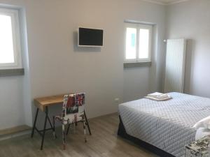 Postel nebo postele na pokoji v ubytování Dimora 16 Rooms & Garden