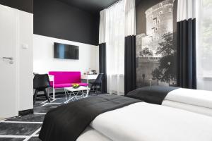 מיטה או מיטות בחדר ב-Best Western Plus Krakow Old Town