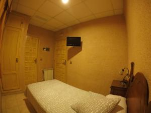 Cama o camas de una habitación en Hostal La Casa de Enfrente