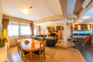 a living room with a table and a couch at Constellation Apartments in Kampala
