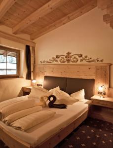 Giường trong phòng chung tại Rimlhof by A CASA