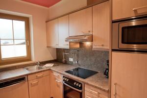 Kuchnia lub aneks kuchenny w obiekcie Rimlhof by A CASA