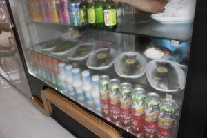 a display case with drinks and sodas in a store at Ataköy Otel Cafe Restaurant in Çaykara